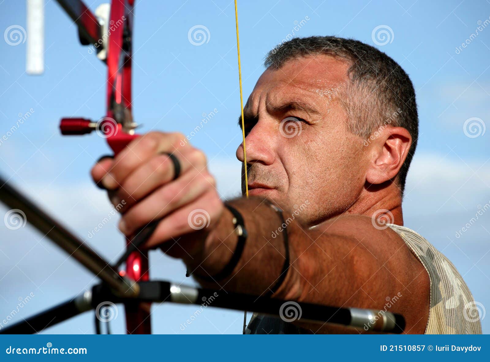 portrait of bowman aiming with bow and arrow