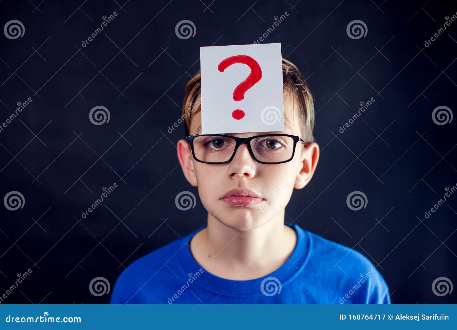 A Portrait of a Boy with Eyeglasses and Question Mark at His Head in ...