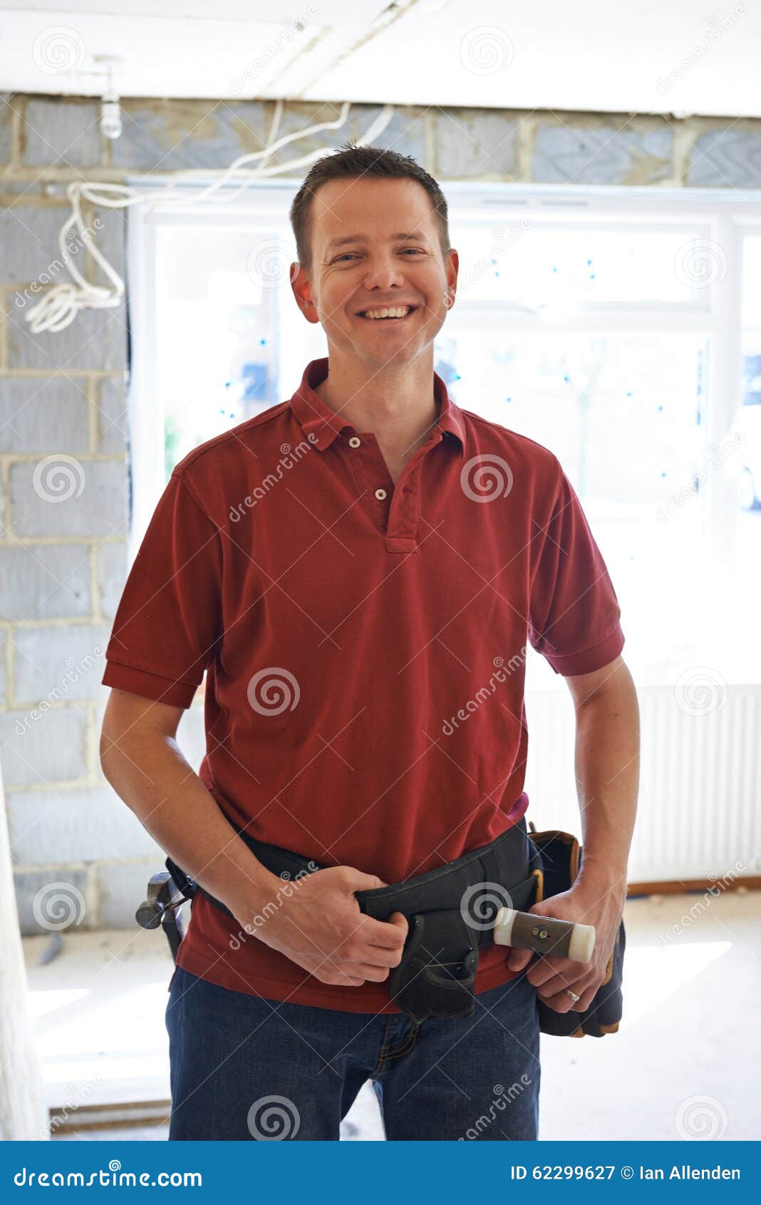 portrait of builder carrying out home improvements