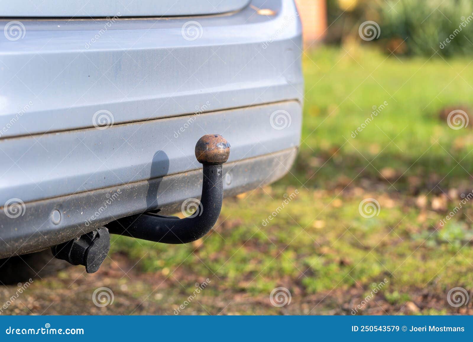 A Portrait of the Bumper at the Back of a Car with a Tow Bar Under it for Pulling Small Trailers