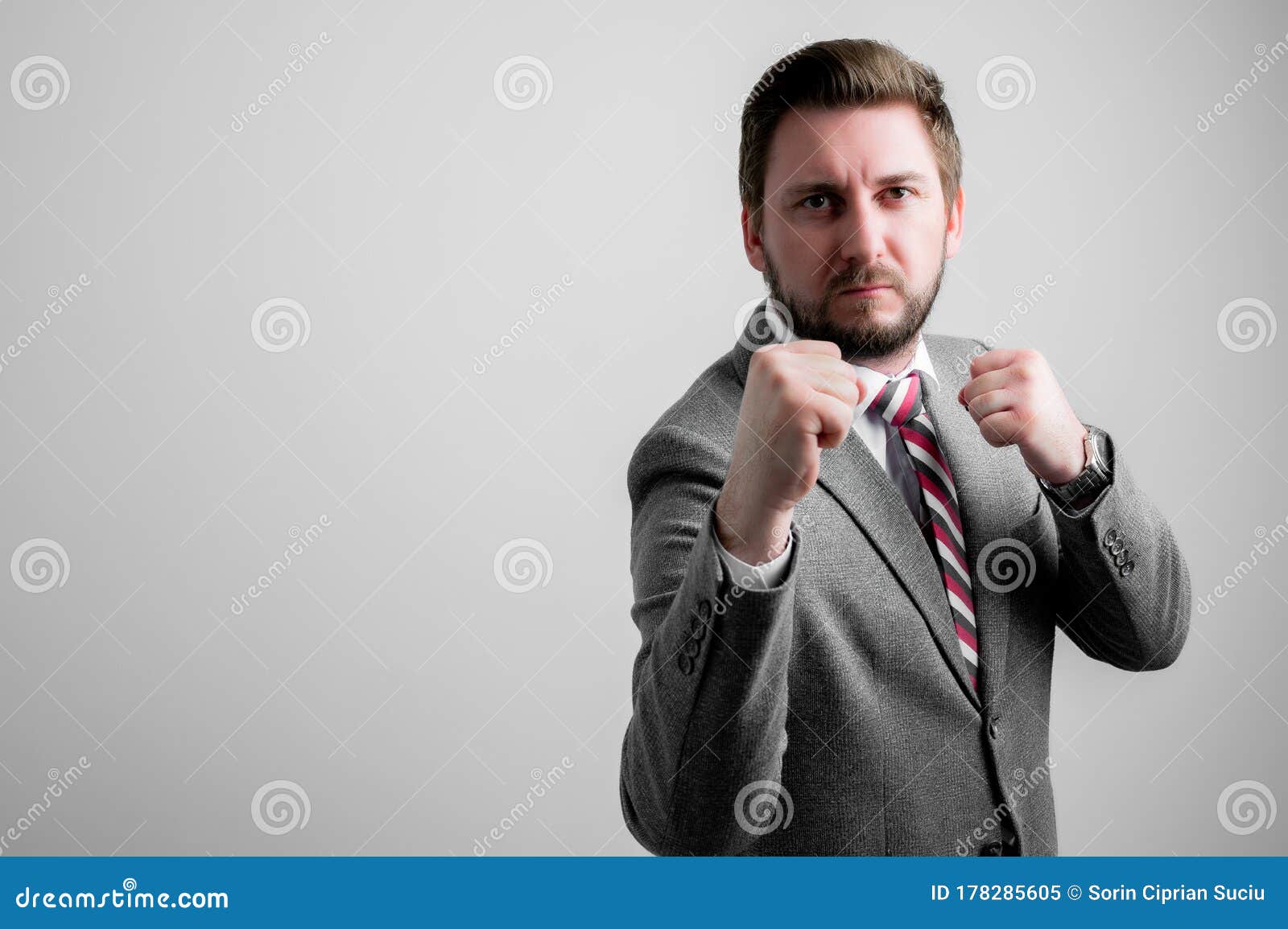 Portrait Of Business Man Wearing Business Clothes Showing Fists Like ...