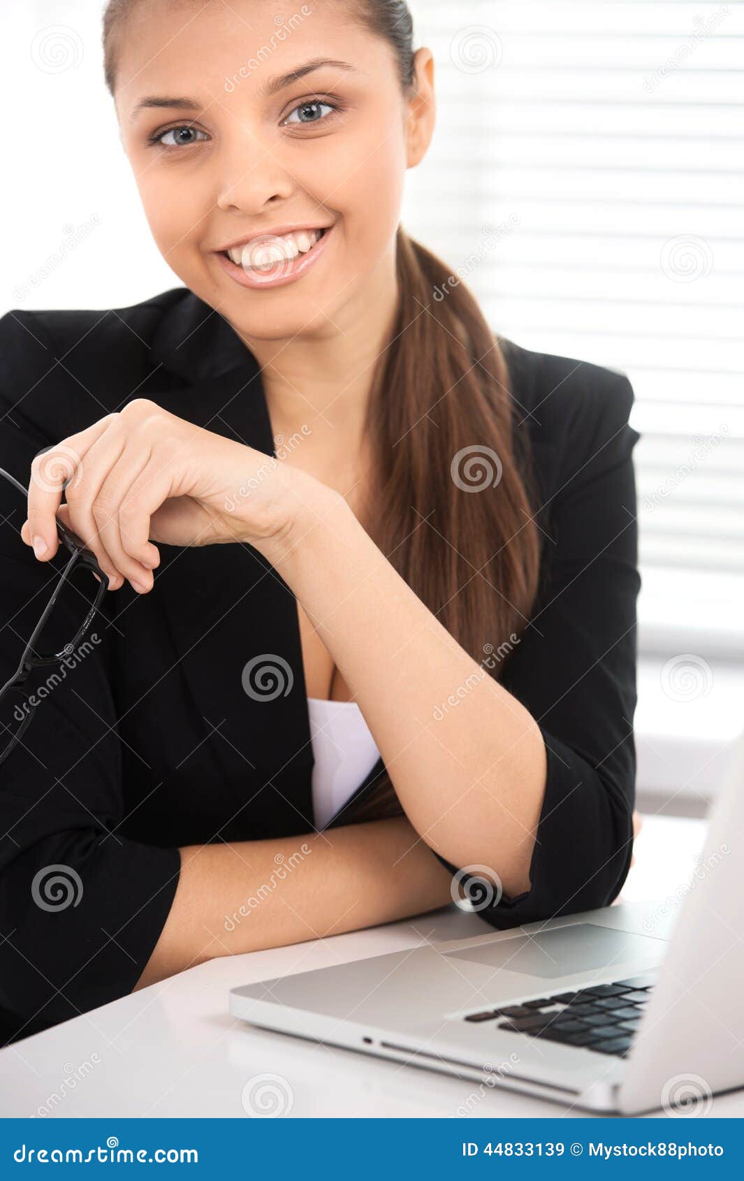 Portrait of Businesswoman Sitting at Desk with Laptop. Stock Image ...