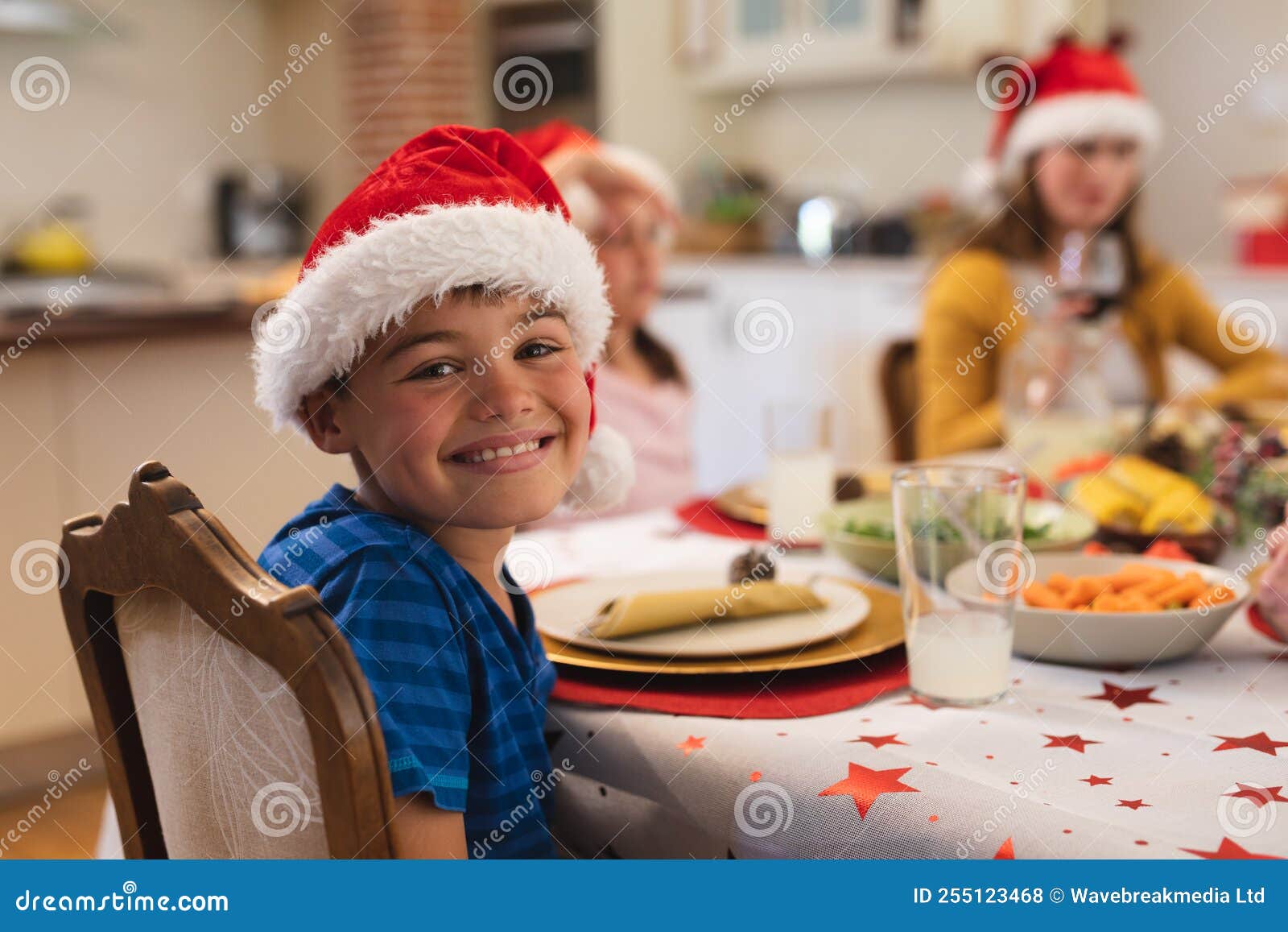 Portrait of Caucasian Boy Sitting at Table for Dinner Stock Photo