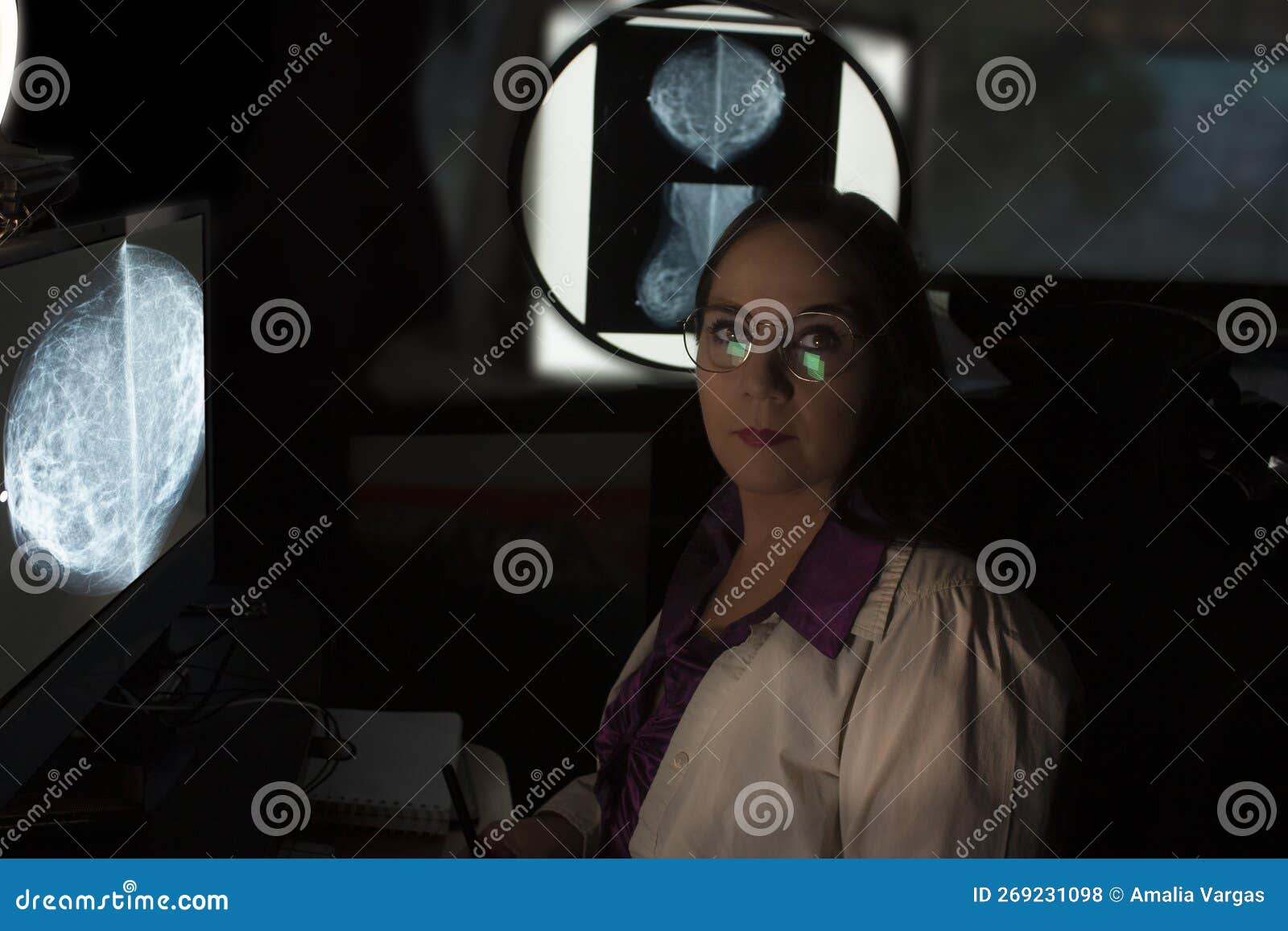 portrait of caucasian woman with glasses radiologist profession making interpretation report image interpretation x-ray