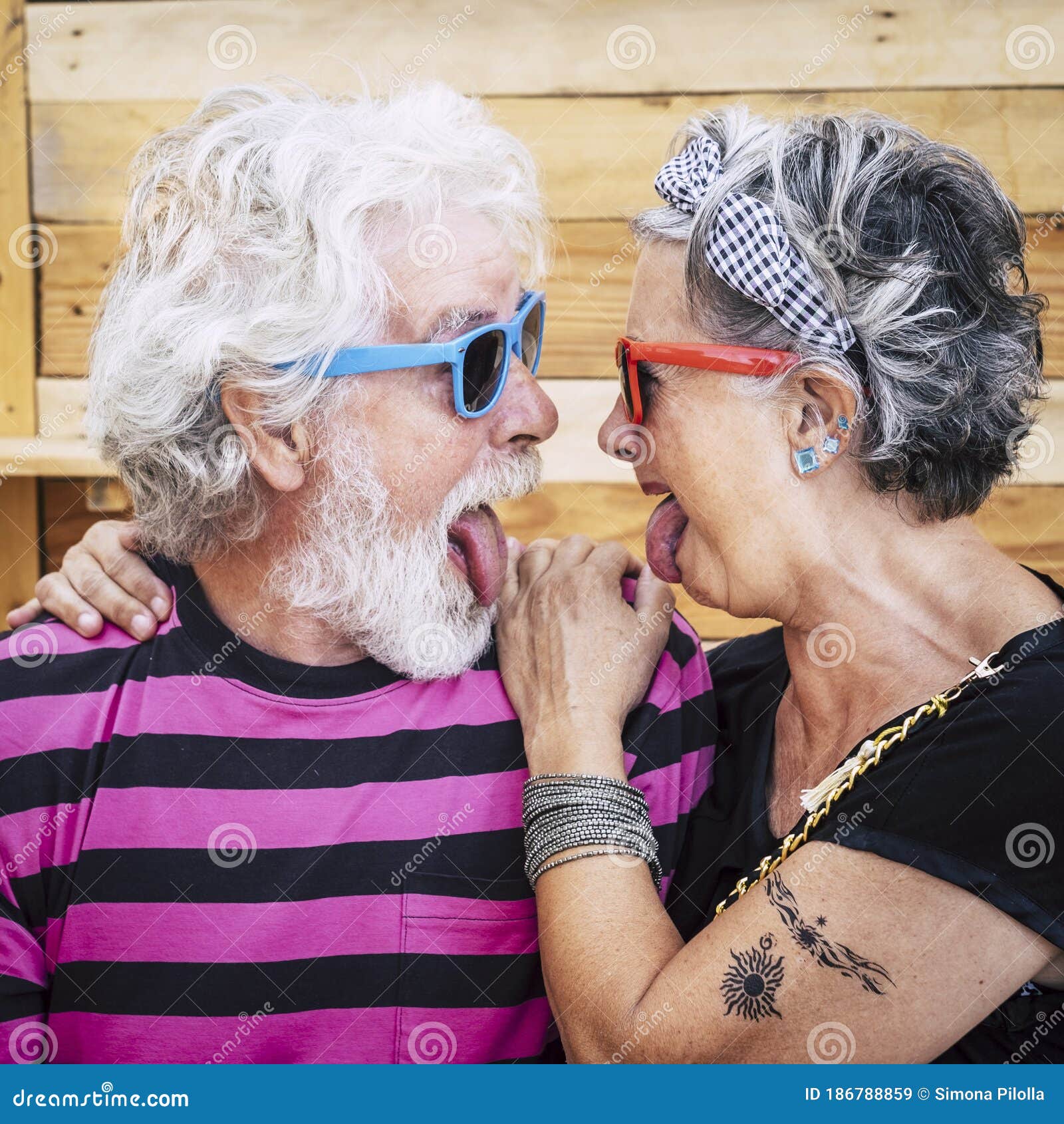 Portrait of Cheerful Caucasian Senior Crazy Couple with Wood Background - Alternative and Young Old People in Funny Expression - Stock Image - Image of love, couple: 186788859 Portrait of Cheerful Caucasian Senior Crazy Couple with Wood Background - Alternative and Young Old People in Funny Expression - Stock Image - Image of love, couple: 186788859