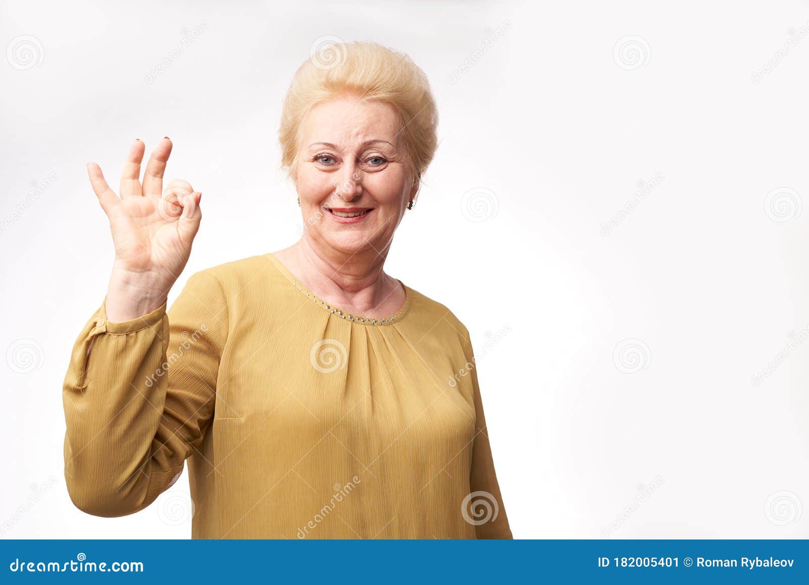 Grandmother portrait on a white background. Portrait of a cheerful grandmother on a white background