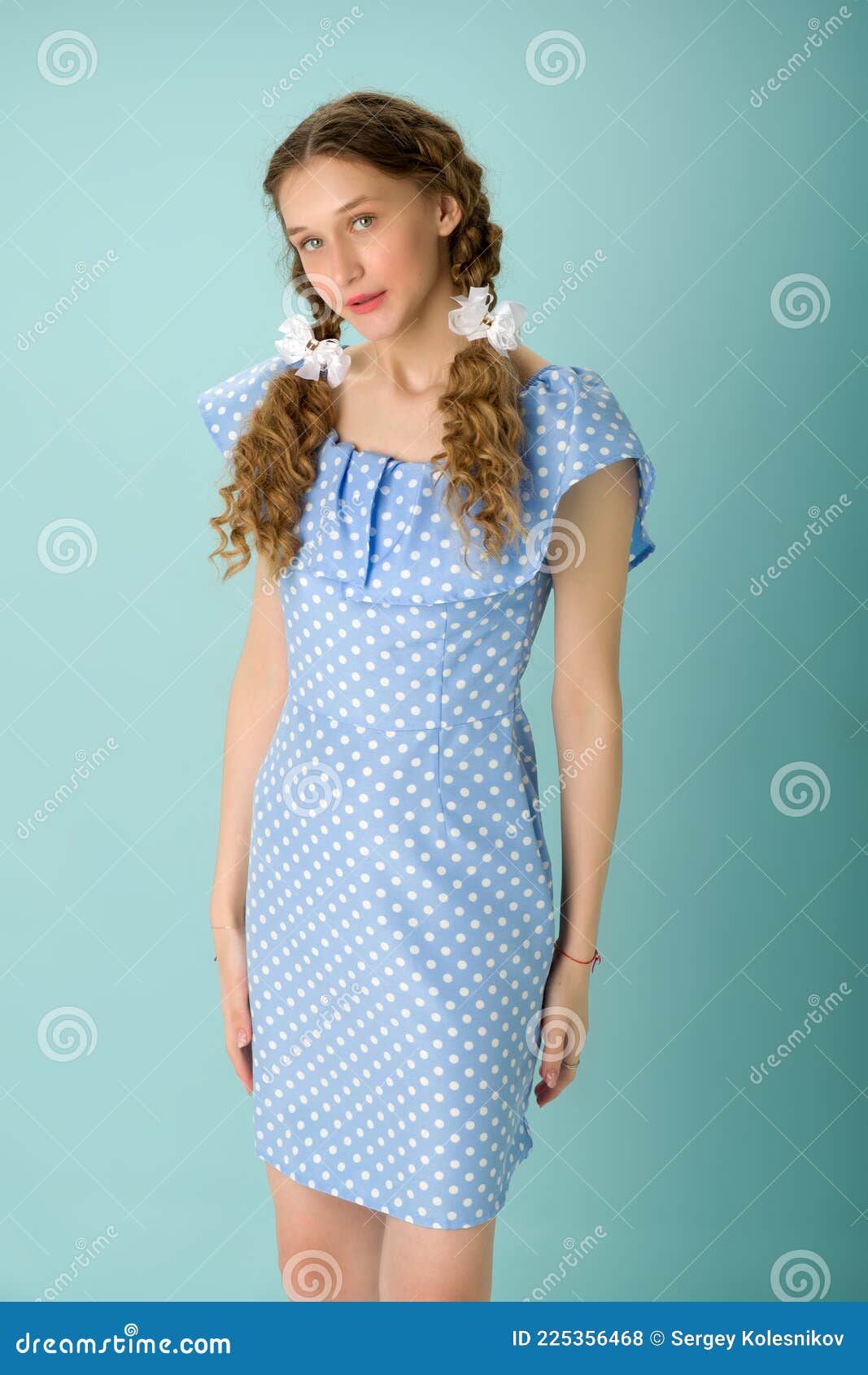 Cheerful Teen Girl in Light Blue Dress ...