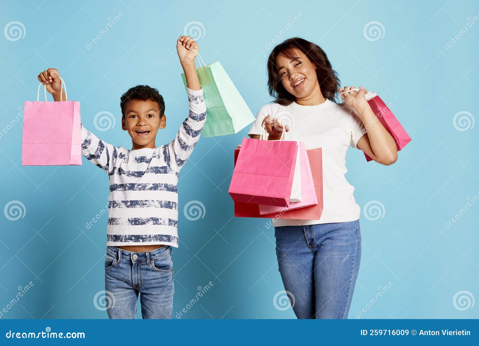 Portrait of Cheerful Woman and Teen Boy Holding Many Shopping Boxes ...