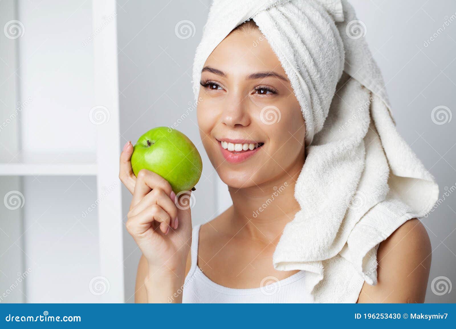 Portrait of a Cheerful Young Woman with Perfect Smile Eating Green ...