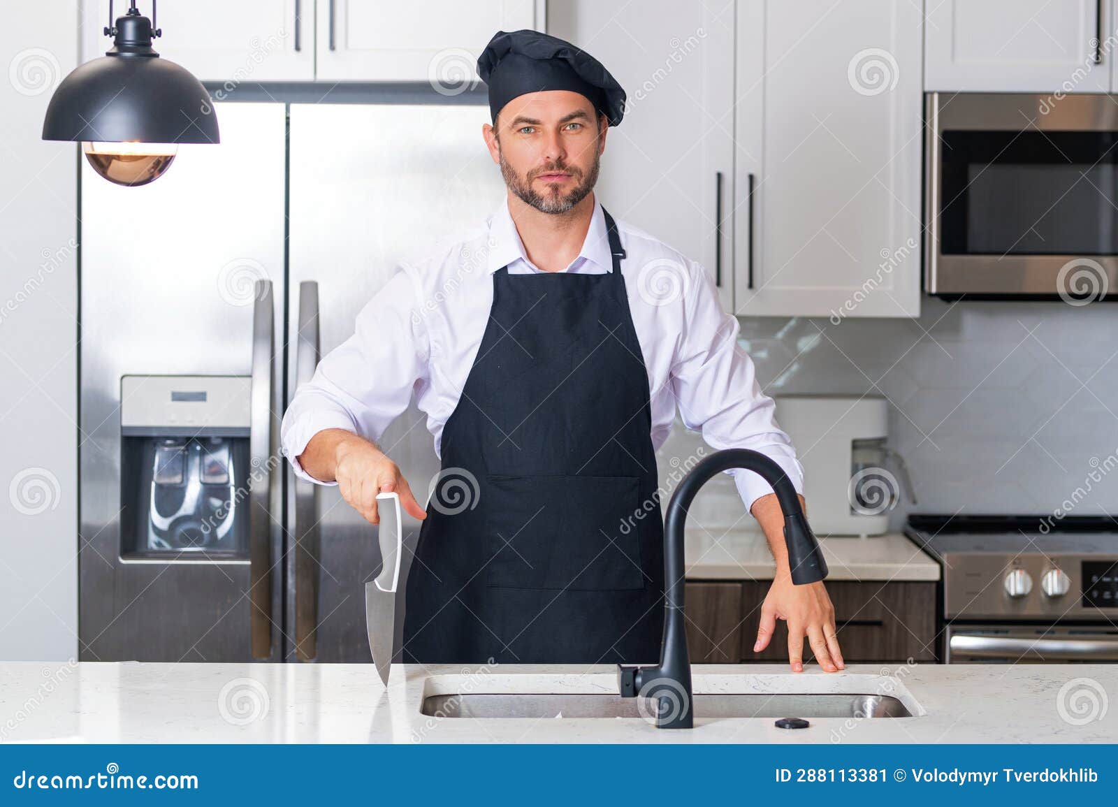 Portrait Of Chef Man In A Chef Cap In The Kitchen Man Wearing Apron vector-sign-of-the-chef-hat-symbol-is-isolated-on-a-white-background