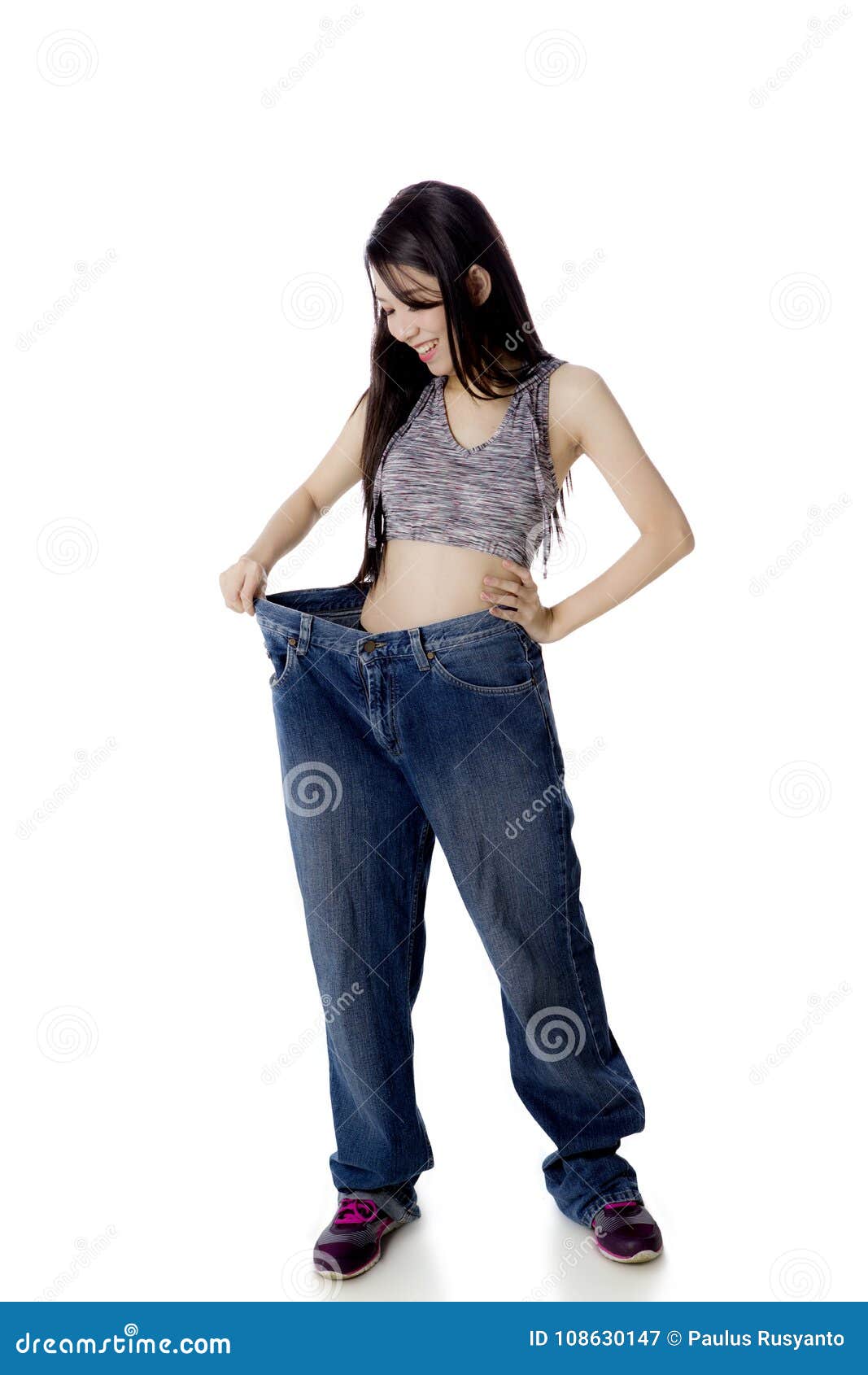 Chinese Woman Wearing Her Old Jeans On Studio Stock Image - Image of ...