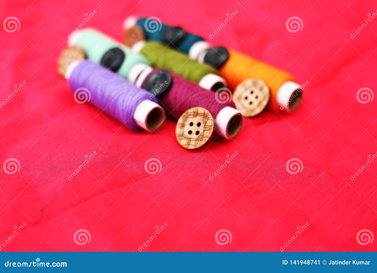 portrait of colored sewing thread and many button