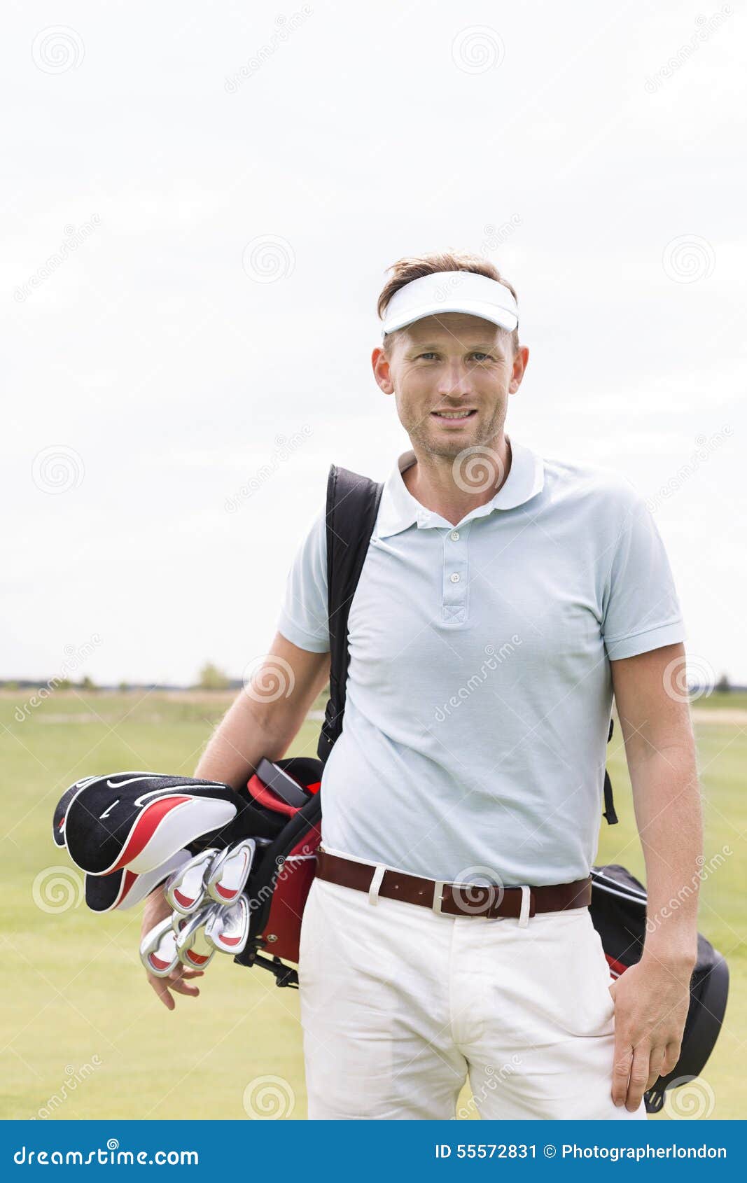 Portrait of Confident Man Carrying Golf Club Bag Against Clear Sky ...