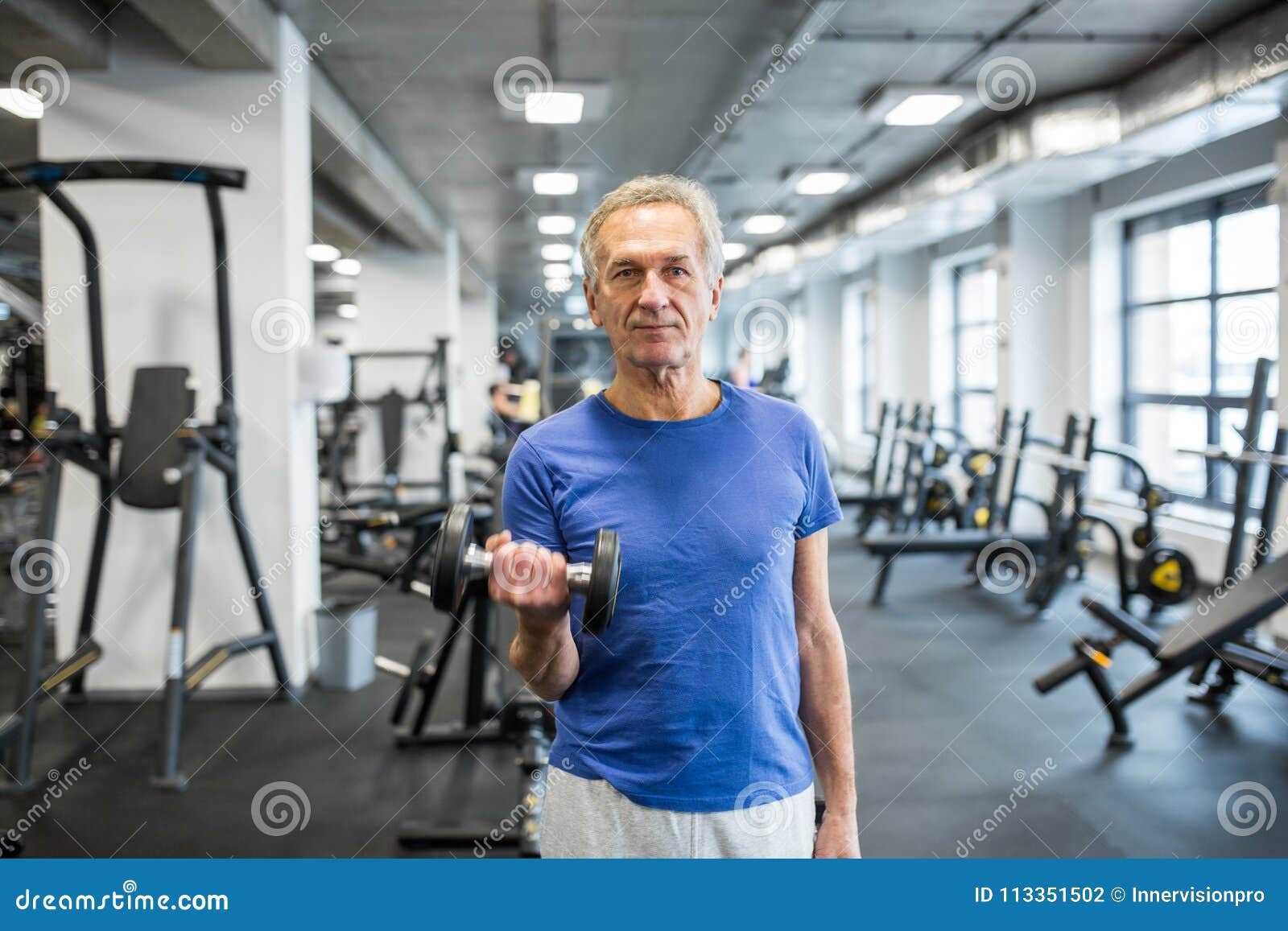 Confident Senior Man Holding Dumbbell in Gym Stock Photo - Image of ...