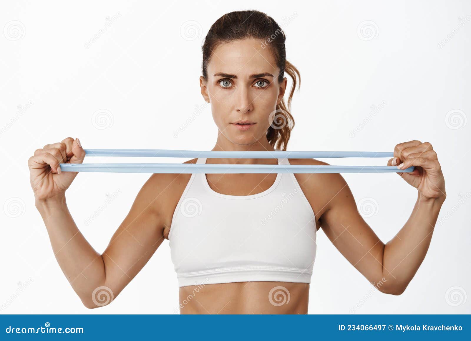 https://thumbs.dreamstime.com/z/portrait-confident-sportswoman-stretching-elastic-band-arms-workout-training-gym-standing-over-white-portrait-234066497.jpg