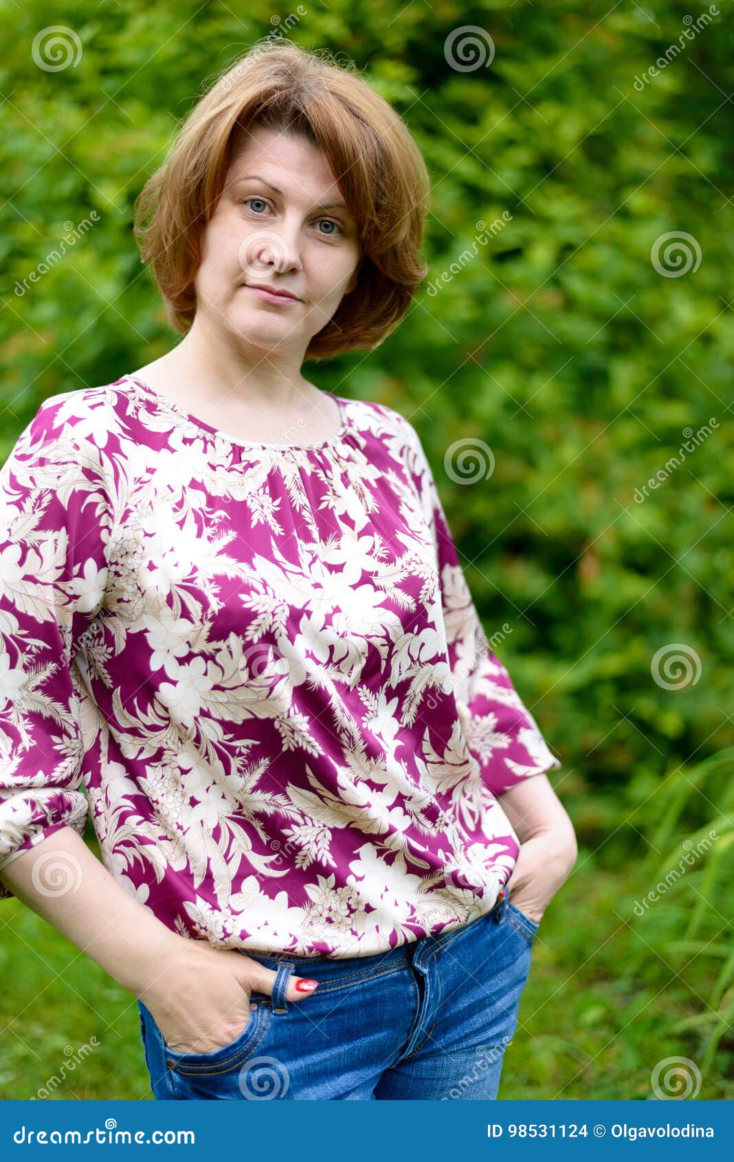 Portrait of Confident Woman Against a Background of Green Foliage Stock ...
