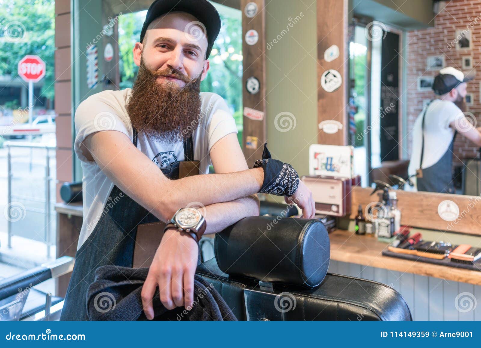 Portrait of a Confident Young Barber Smiling in a Vintage Beauty Salon ...