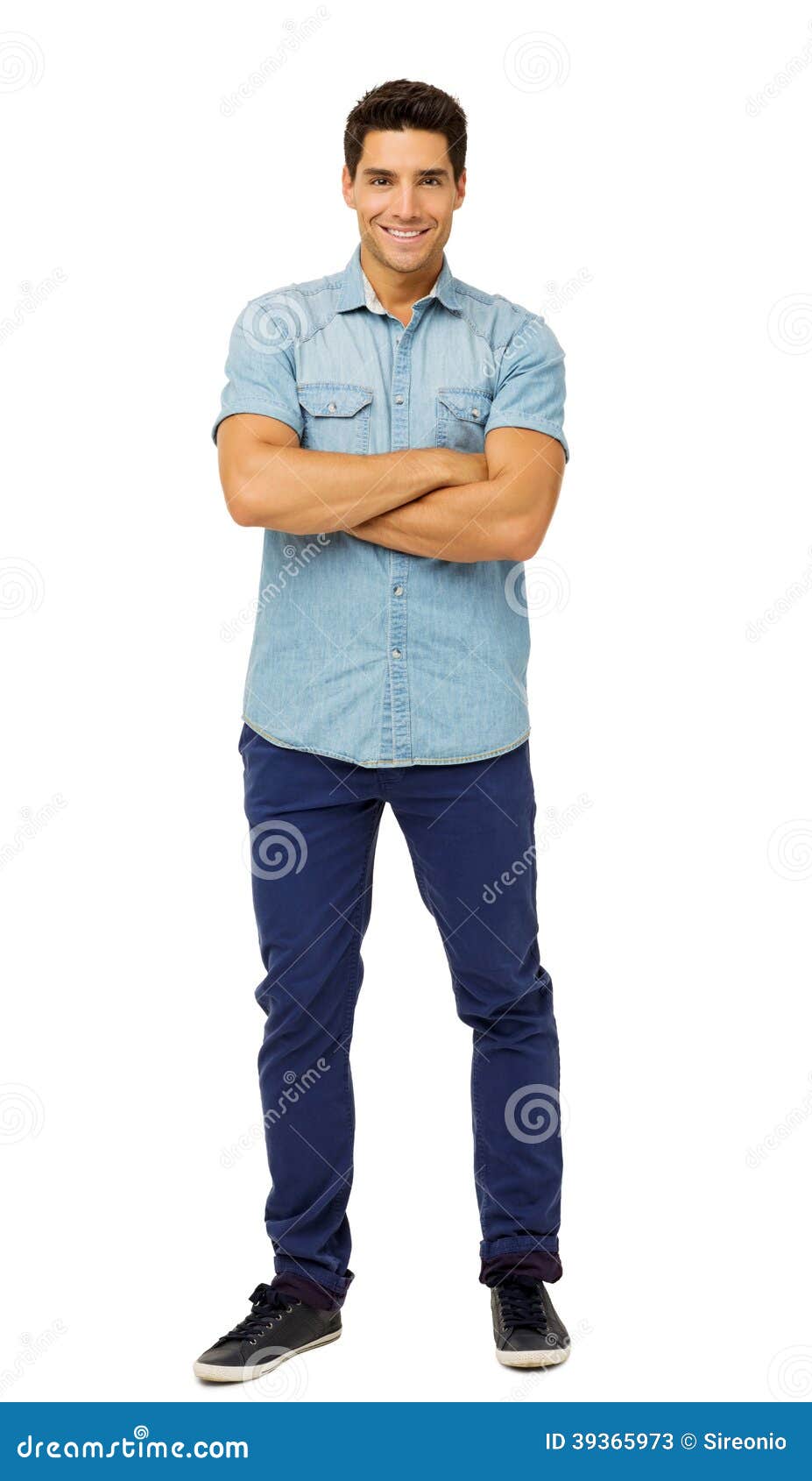 portrait of confident young man standing arms crossed