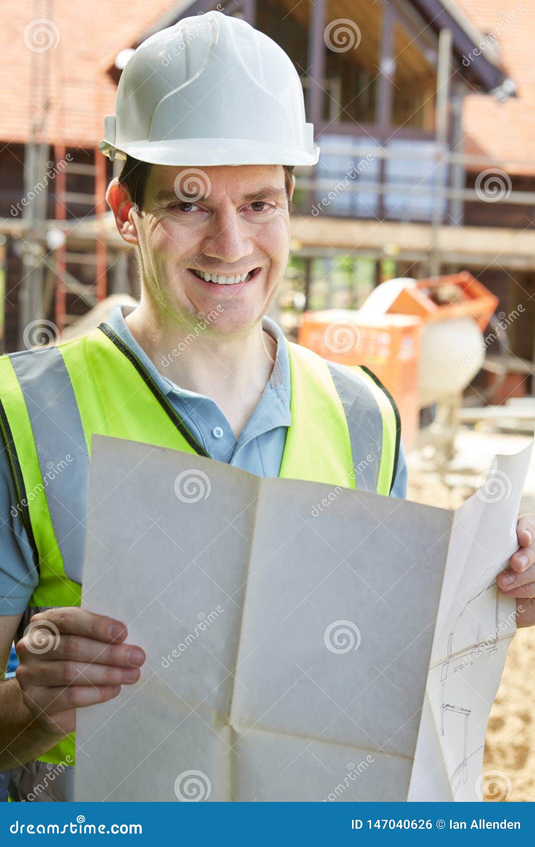 Portrait of Construction Worker on Building Site Looking at House Plans