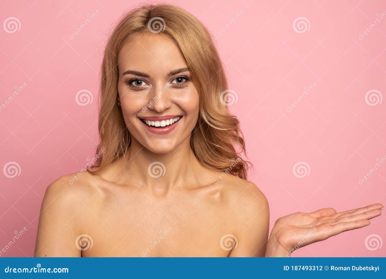 Portrait With Copy Space Of Nude Happy Smiling Girl With Big Eyes Demonstrate Empty Place On