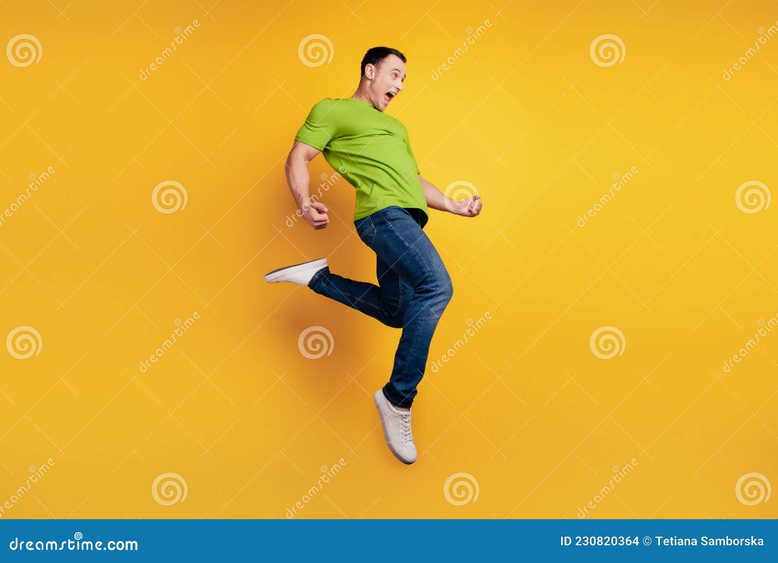 Portrait of Crazy Winner Excited Guy Jump Funny Pose on Yellow Wall ...