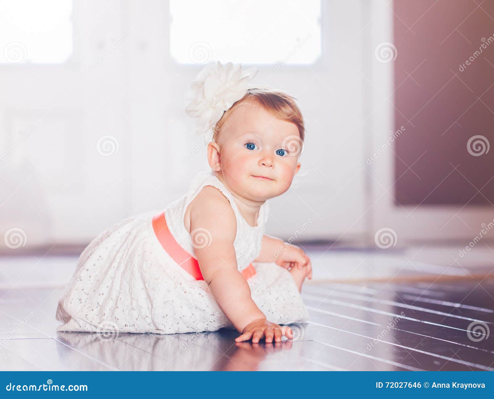 Portrait Of Cute Adorable Blonde Caucasian Smiling Baby Child Gi photo