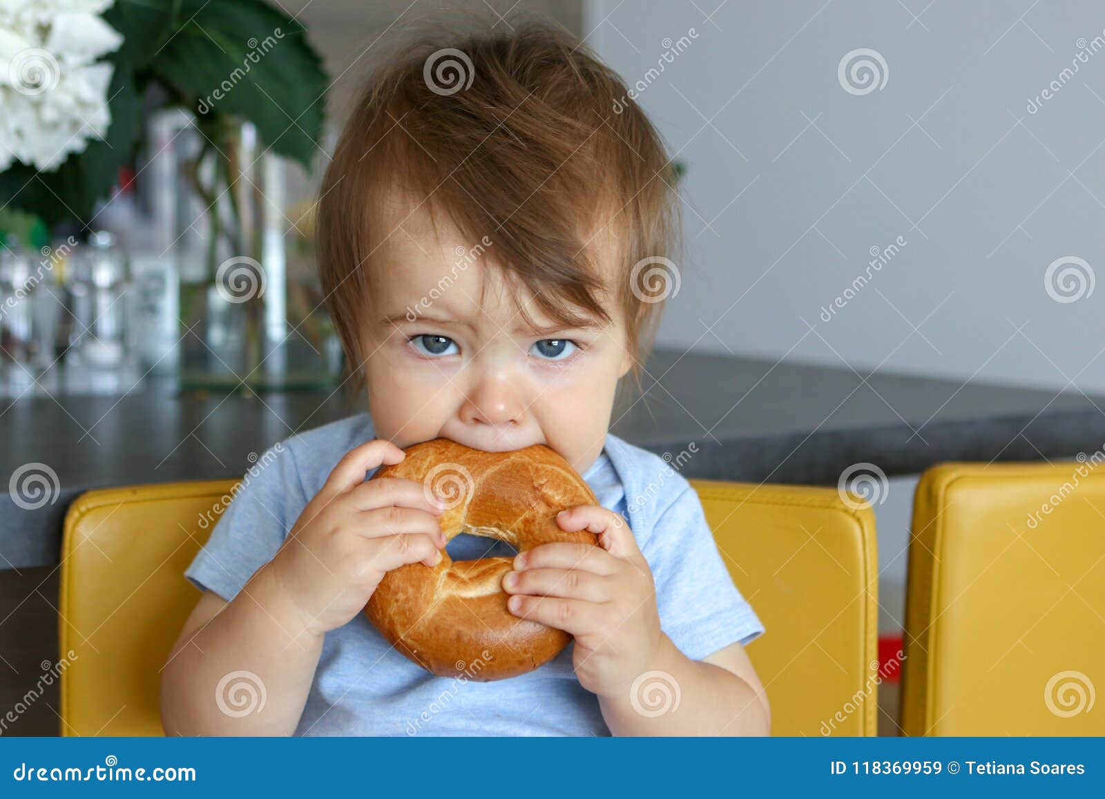 Portrait of Cute Baby Boy with Stylish Haircut Holding and Eating ...