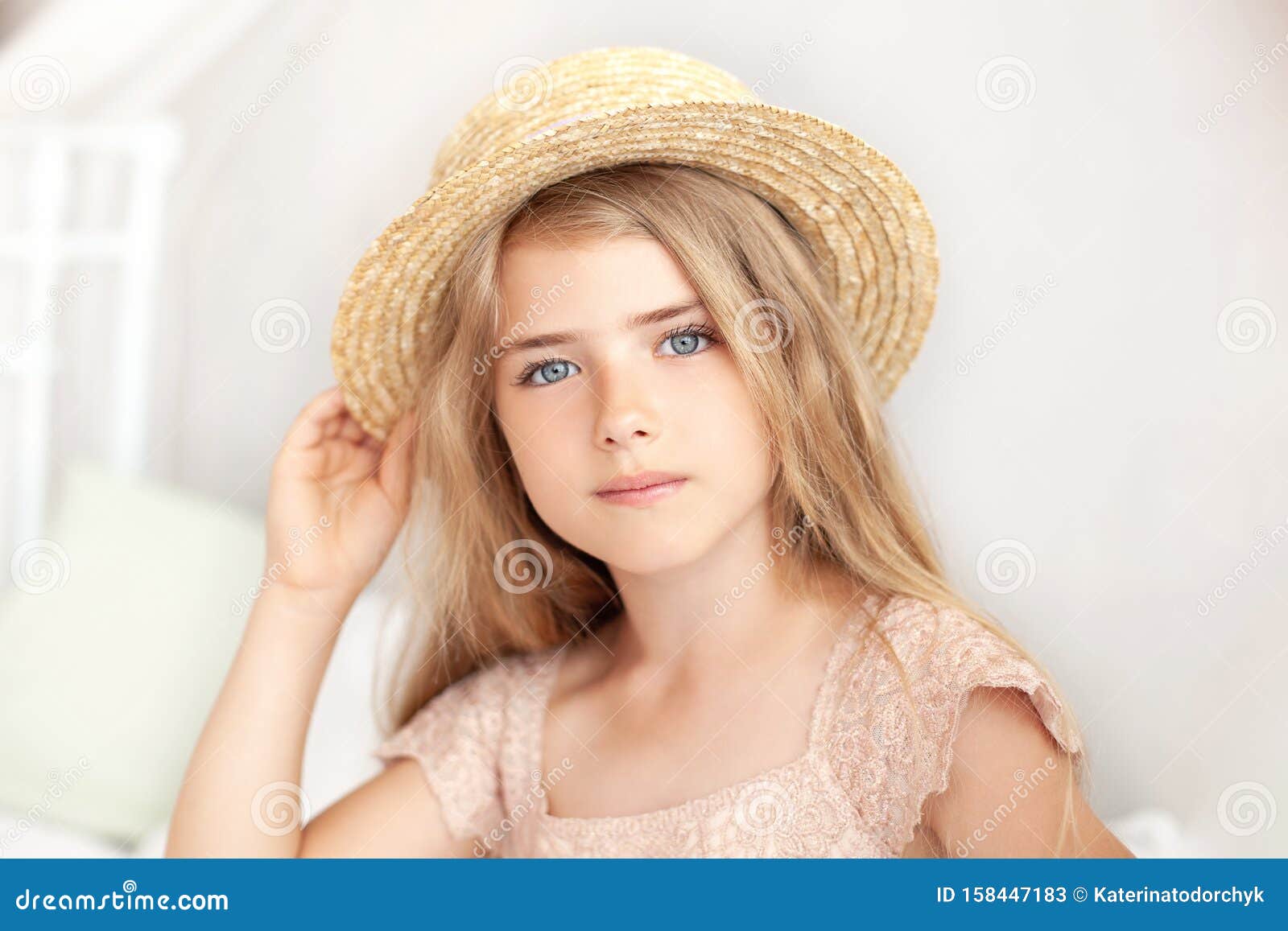 Portrait of a Cute Girl in a Straw Hat. Thoughtful Little Blonde ...