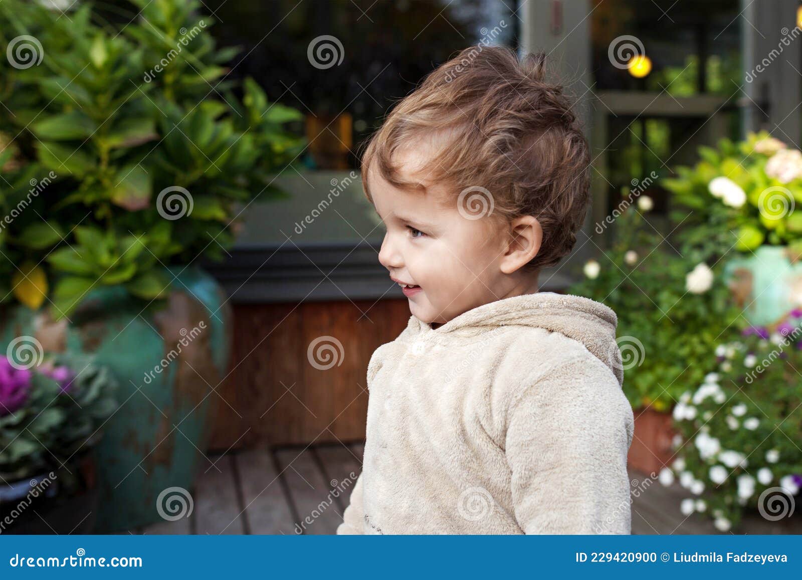portrait of cute  little  boy. happy lovley child outside. look aside
