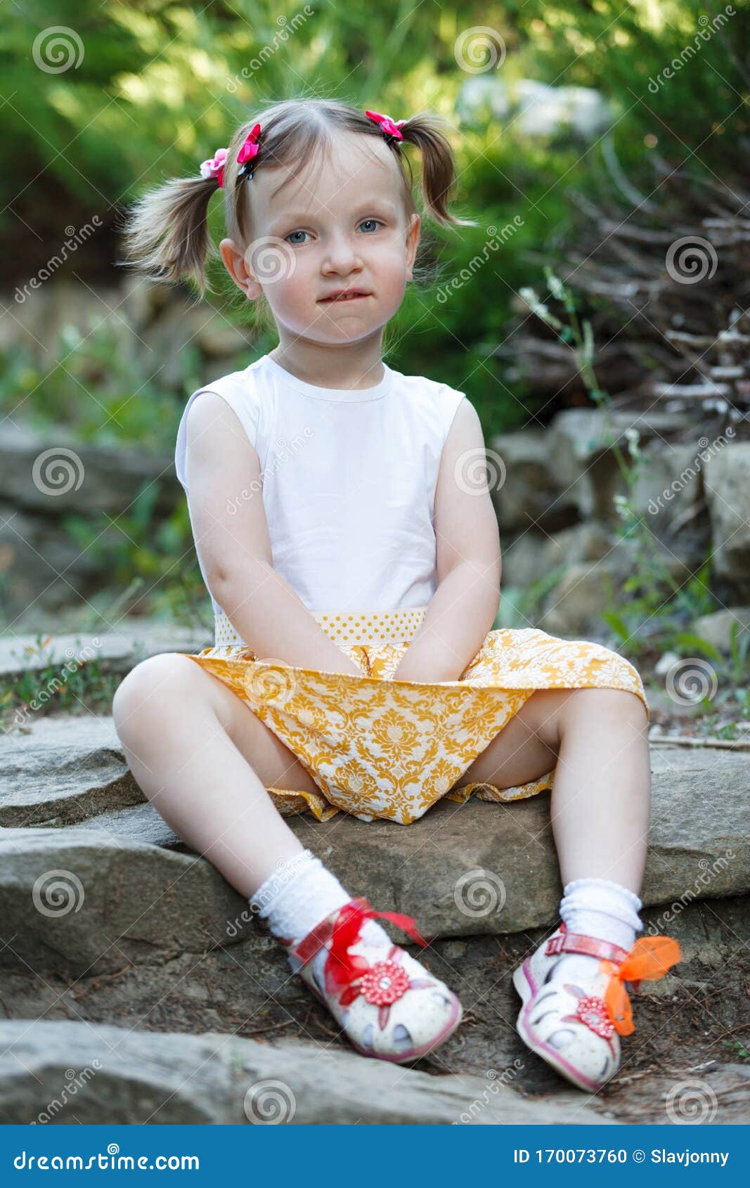 Portrait of a Cute Little Girl on the Background of Nature. she`s ...