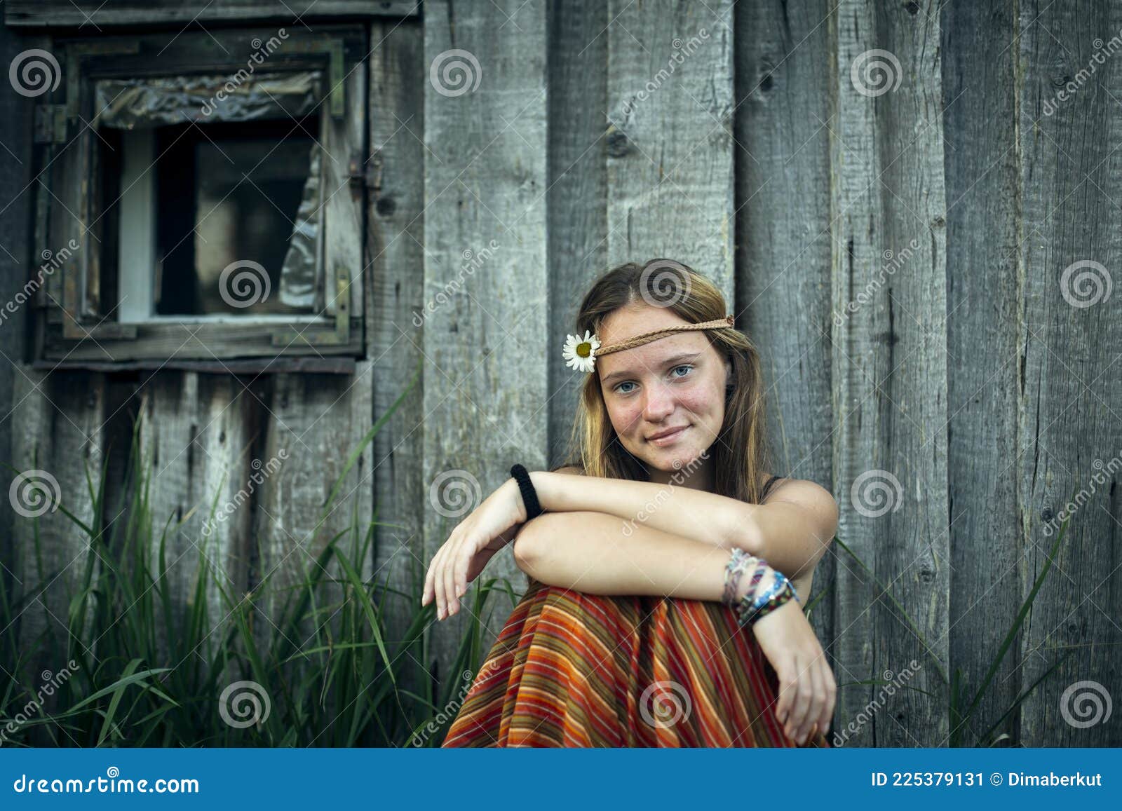 Portrait of a Cute Rural Teengirl Sitting on the Ground Outdoors. Stock ...