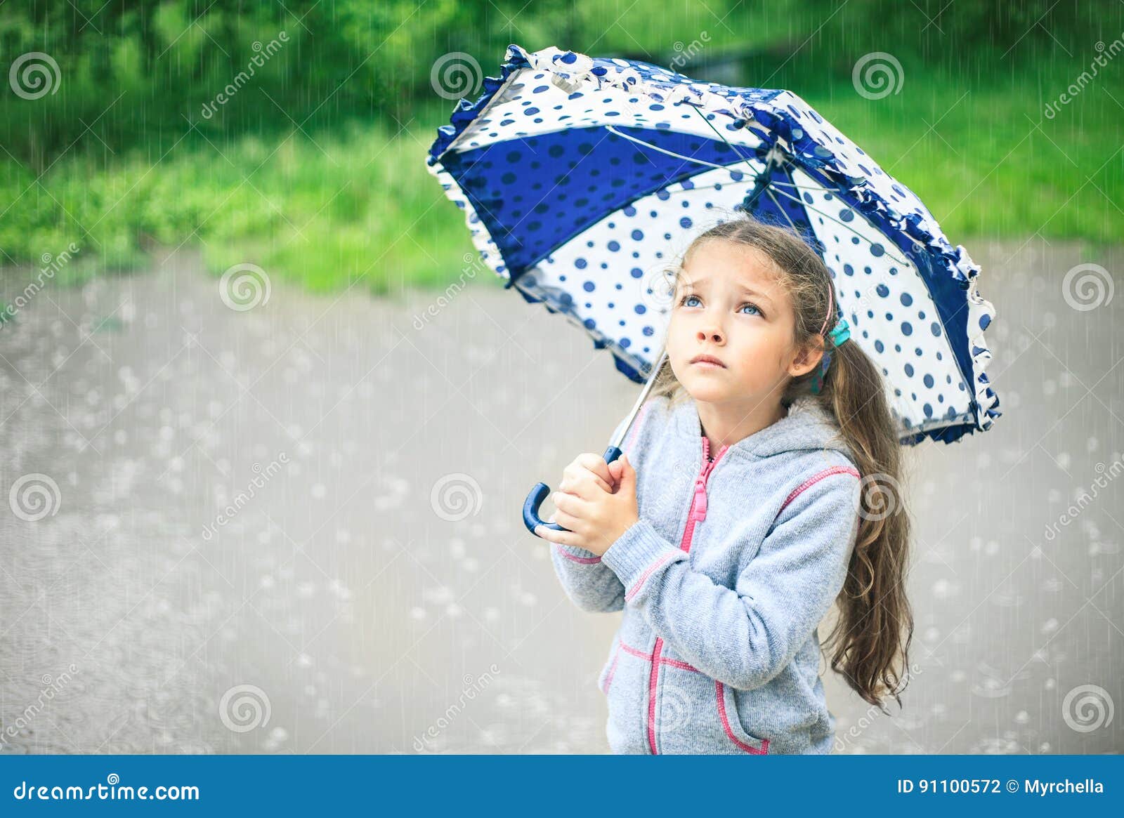 Portrait Of A Cute Sad Girl With An Umbrella Stock Photo