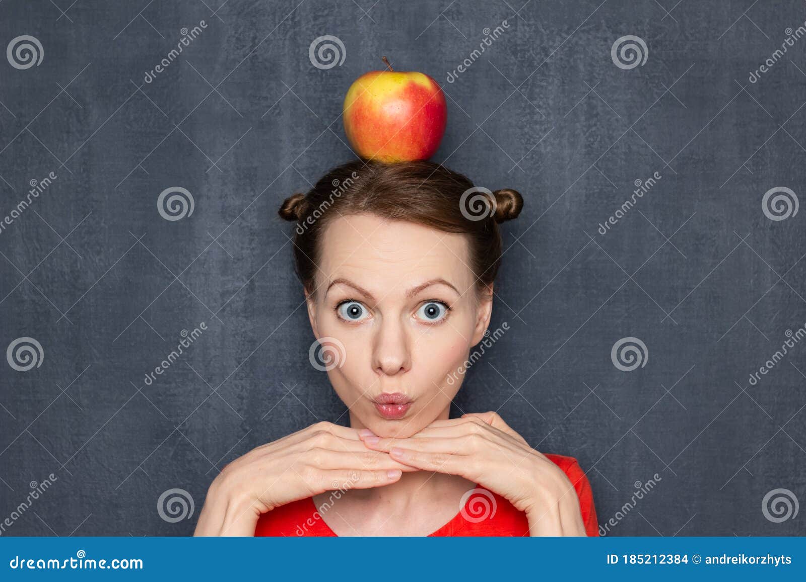 Portrait of Cute Surprised Girl with Apple on Head Stock Photo - Image of  diet, blond: 185212384