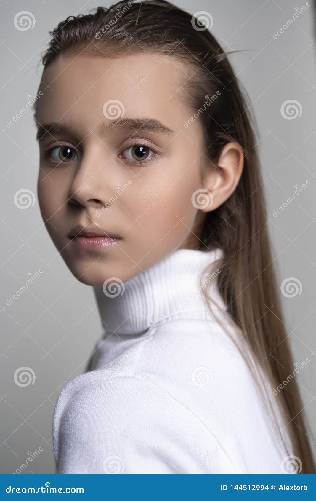 Portrait of a Cute Teen Girl Wearing a White Turtleneck Sweater