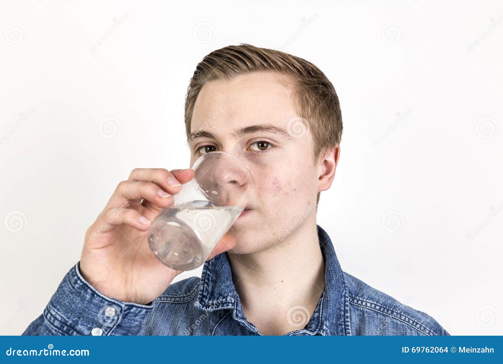 Teen boy drinking water Stock Photo by ©VaLiza 114884958