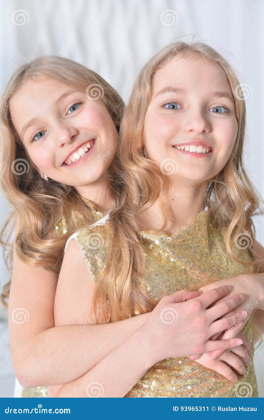 portrait of a cute twin sisters