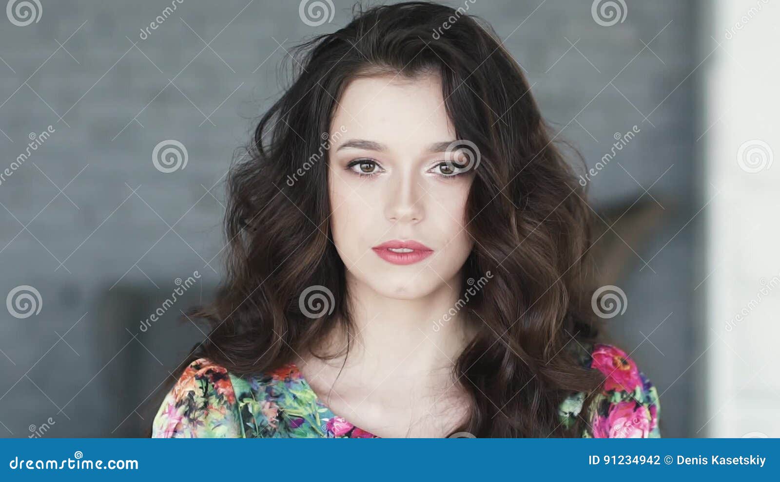 Portrait of a Cute Young Brunette with picture