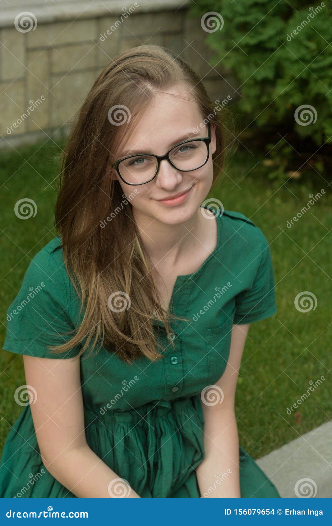 Portrait Of Cute Young Girl With Eyeglasses Smiling B