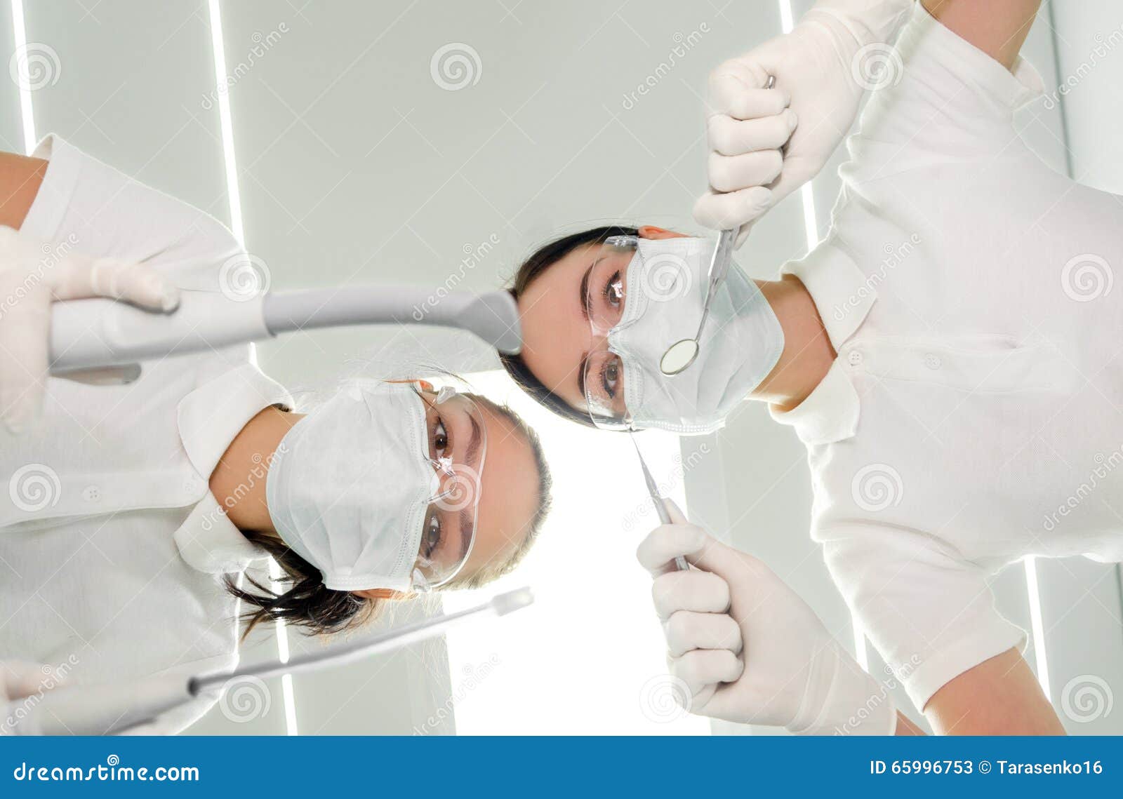Portrait of Dentist and His Assistant the Patient S Eye View from Low
