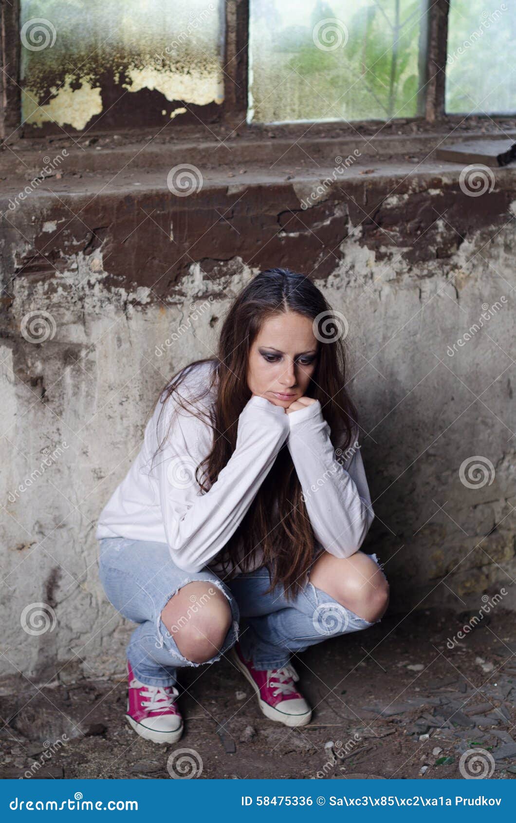 Portrait of Depressed Young Girl Leaning on Wall of Ruined Building ...