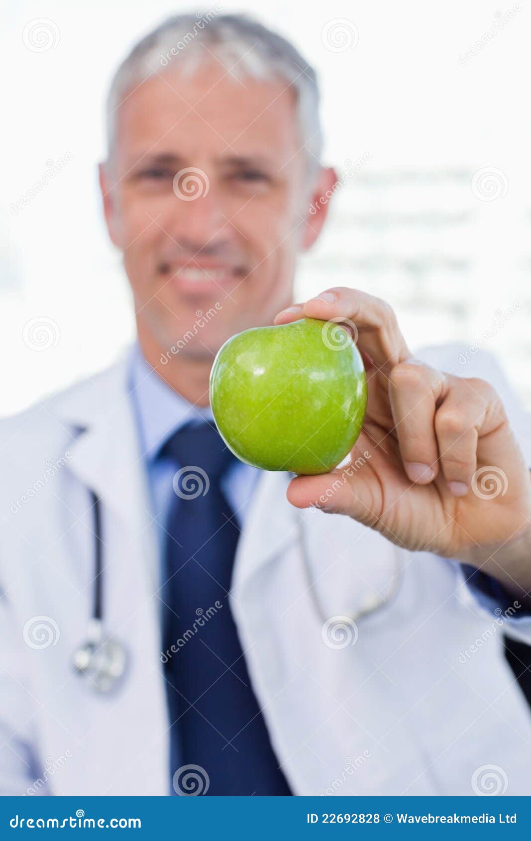 Portrait of a Doctor Showing an Apple Stock Photo Image of portrait