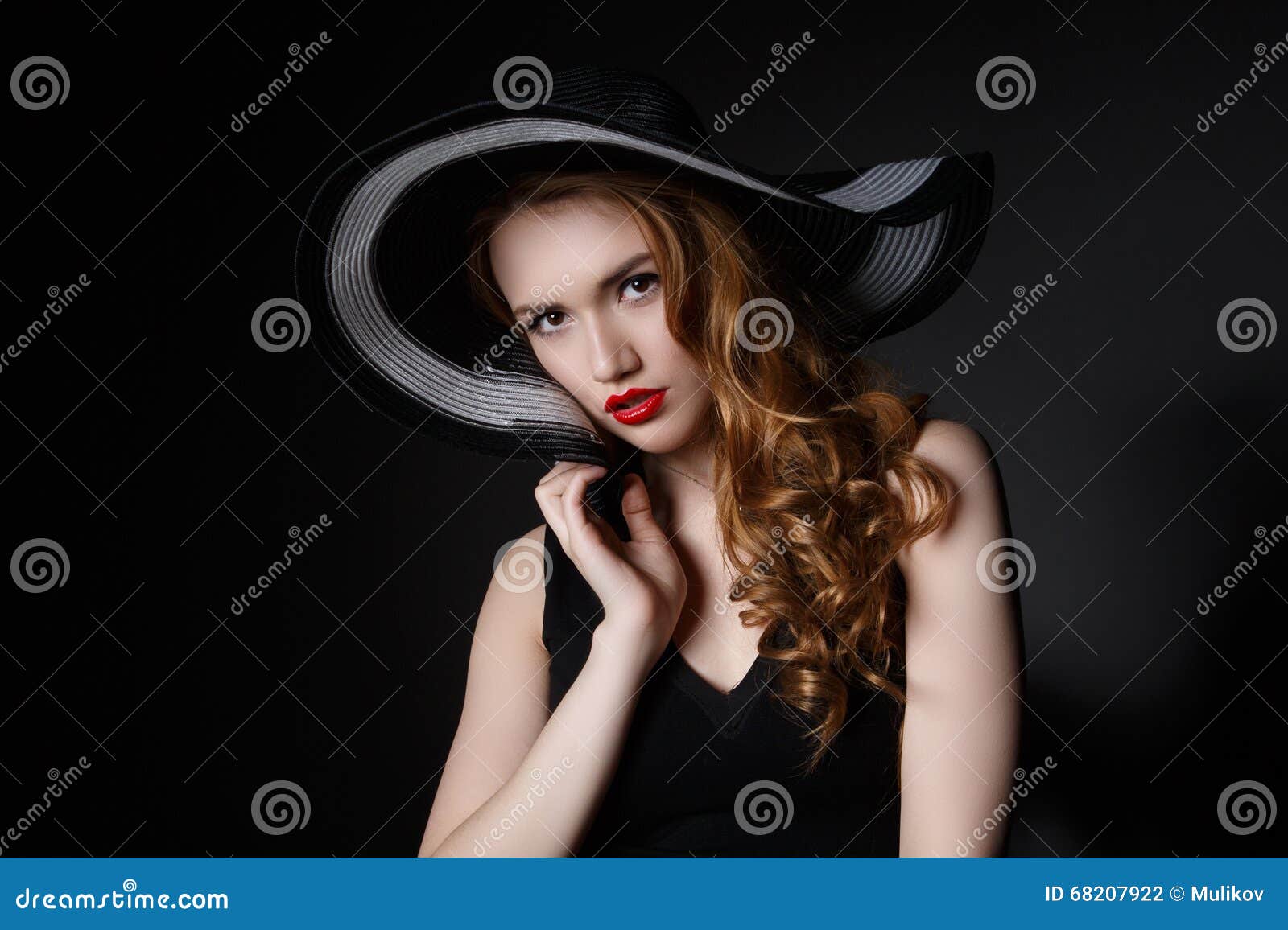 Portrait of Elegant Woman in Black Hat and Dress. Stock Photo - Image ...