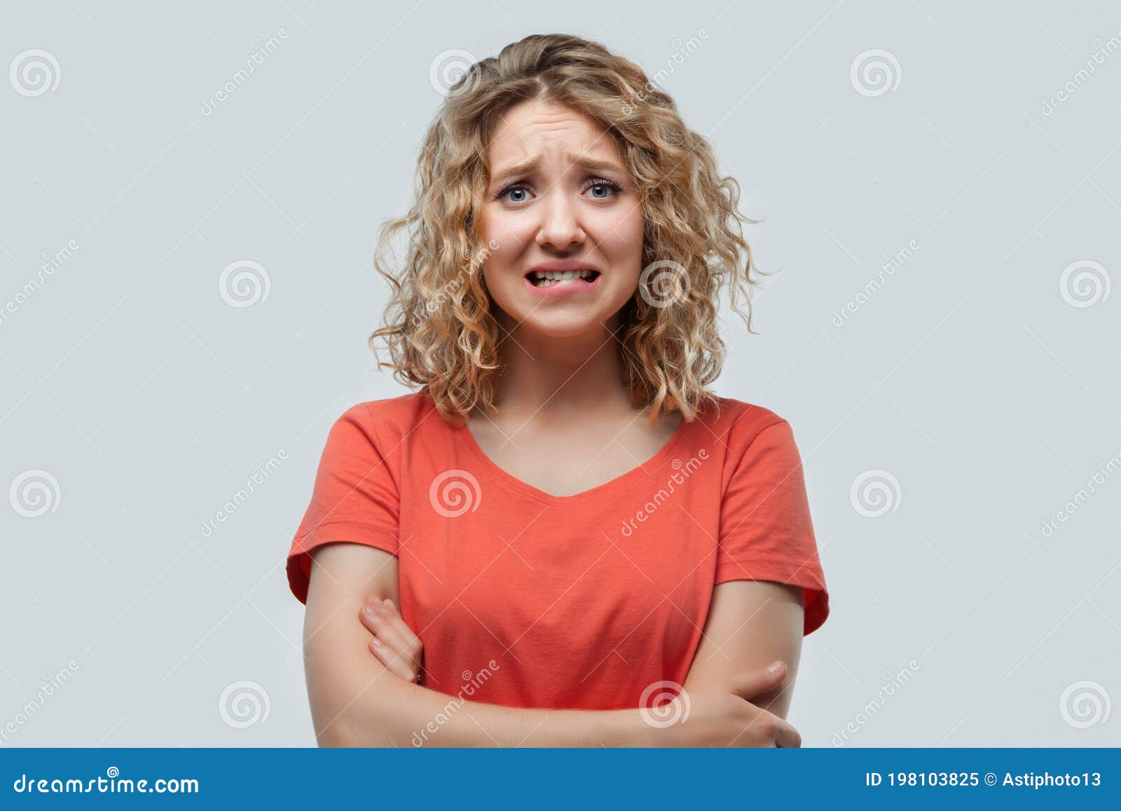 Portrait Of Embarrassed Blonde Girl In Casual T Shirt Looking At Camera Human Emotions Facial 