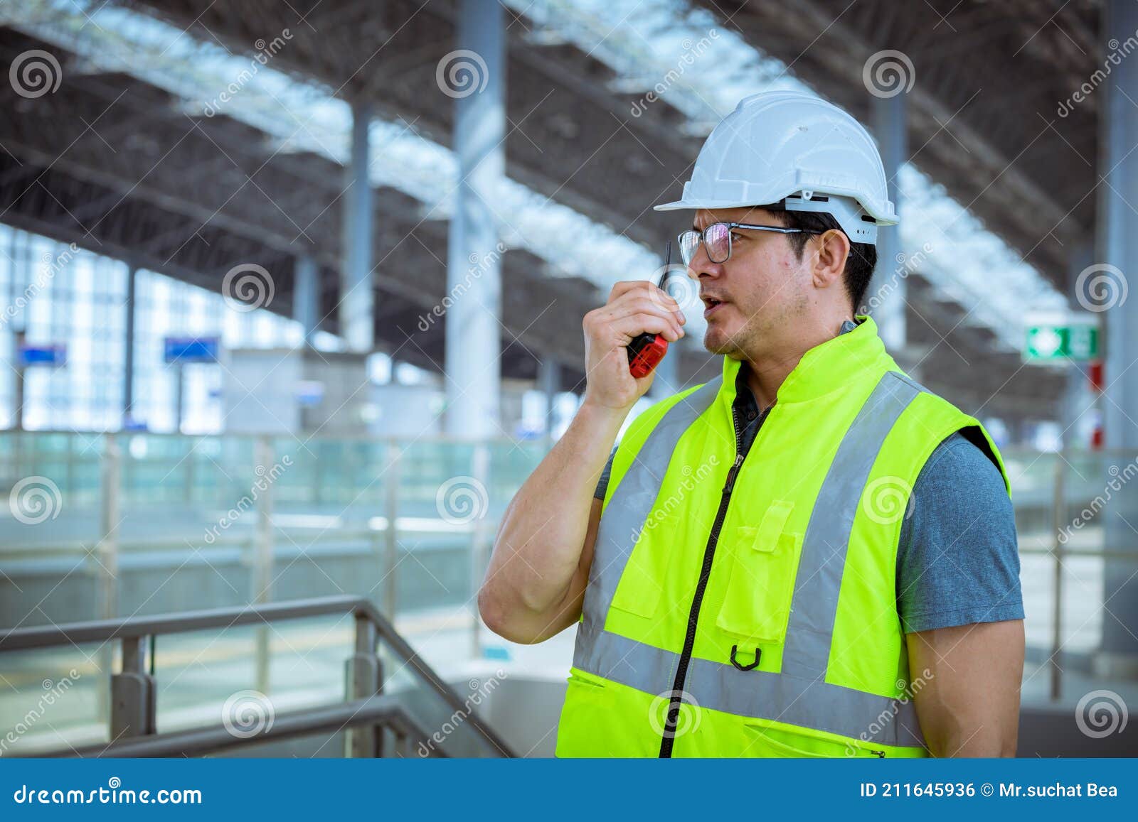 portrait engineer under inspection and checking construction process railway and checking work on railroad station .engineer weari