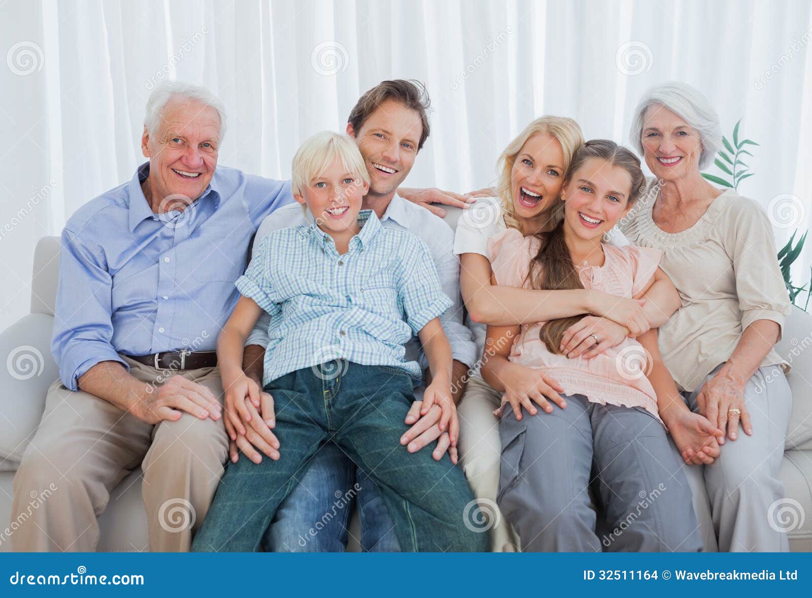 Portrait of an Extended Family Sitting on Couch Stock Photo Image of