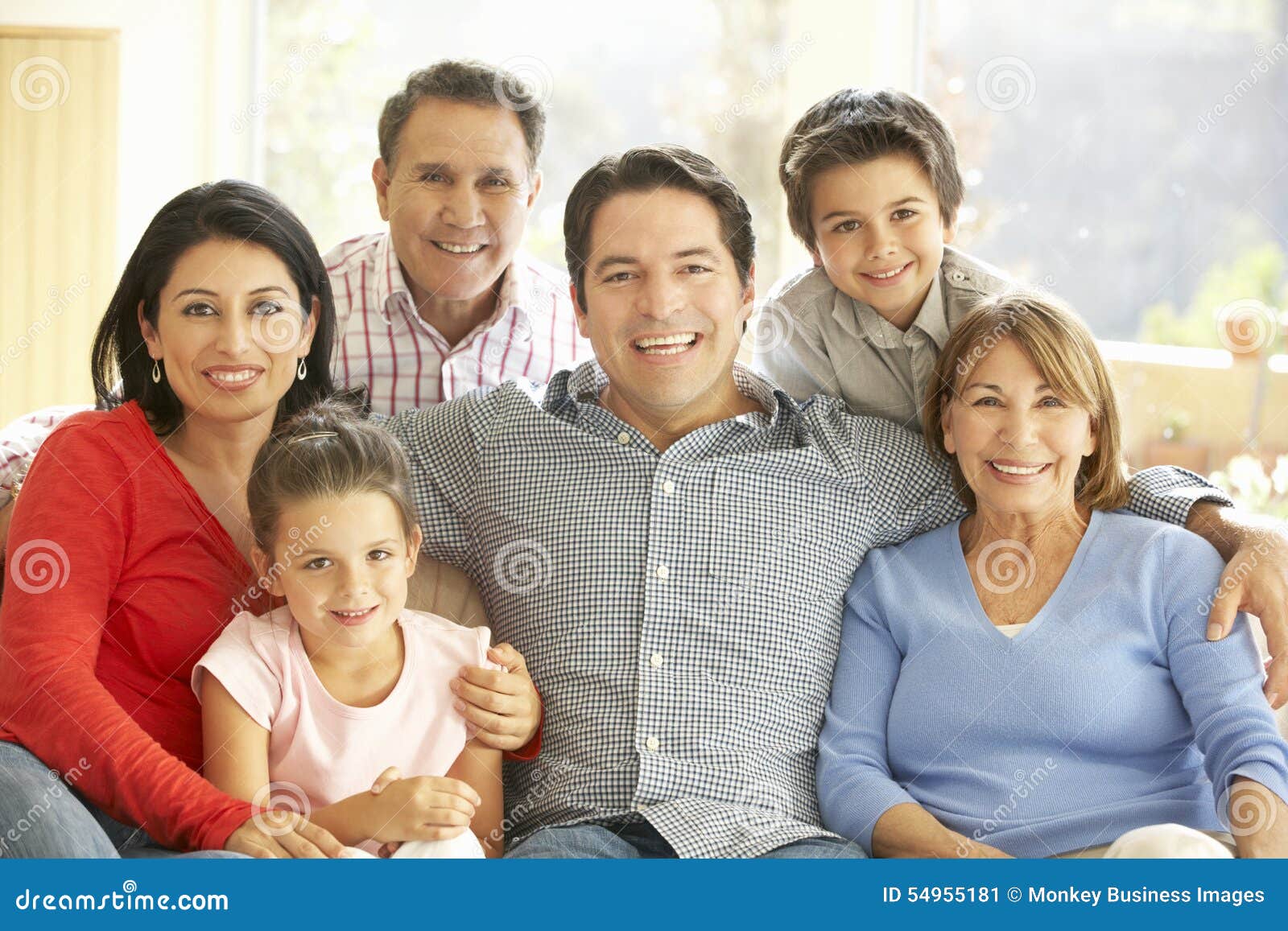 portrait of extended hispanic family relaxing at home