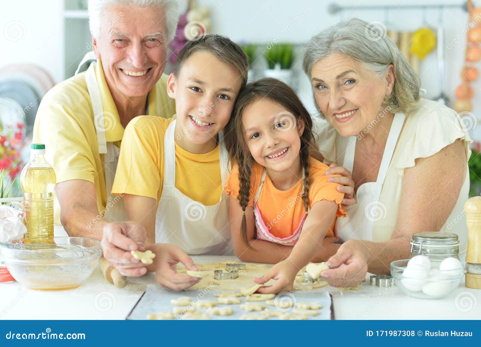 Portrait of Family L Baking Together in the Kitchen Stock Photo - Image