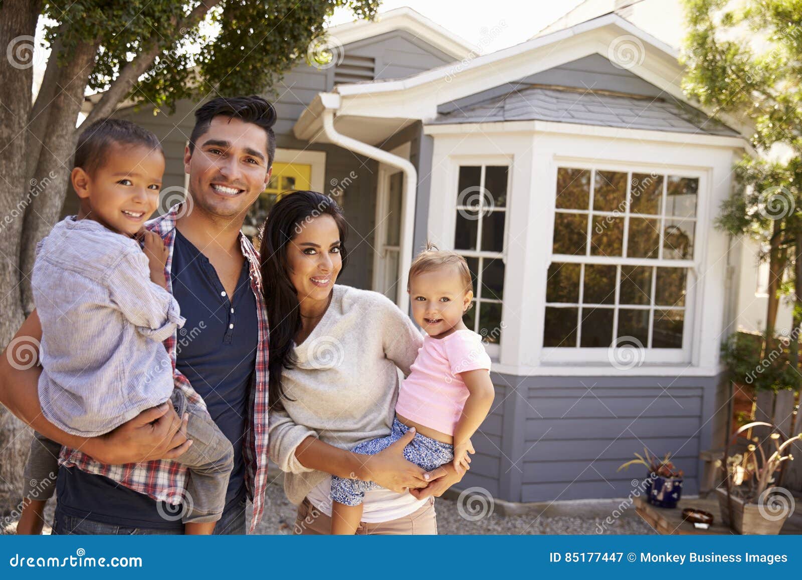Portrait of Family Standing Outside Home Stock Image Image of looking