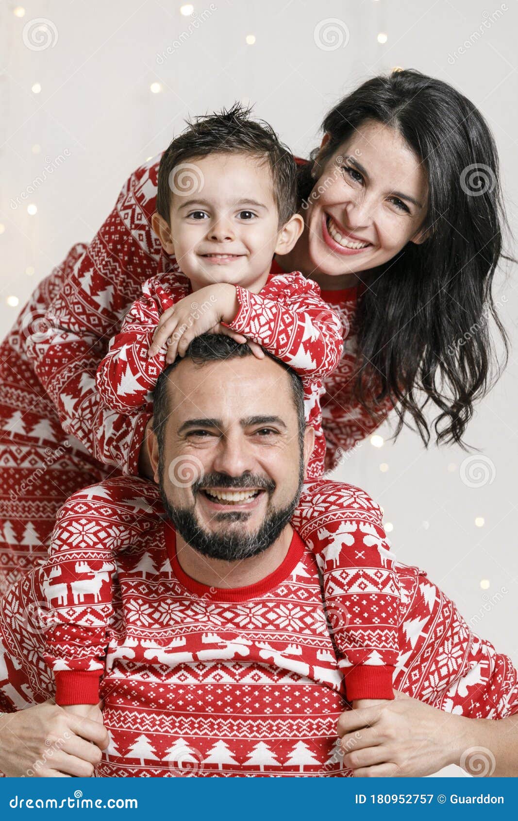 portrait family wearing christmas pajamas young poses studio 180952757