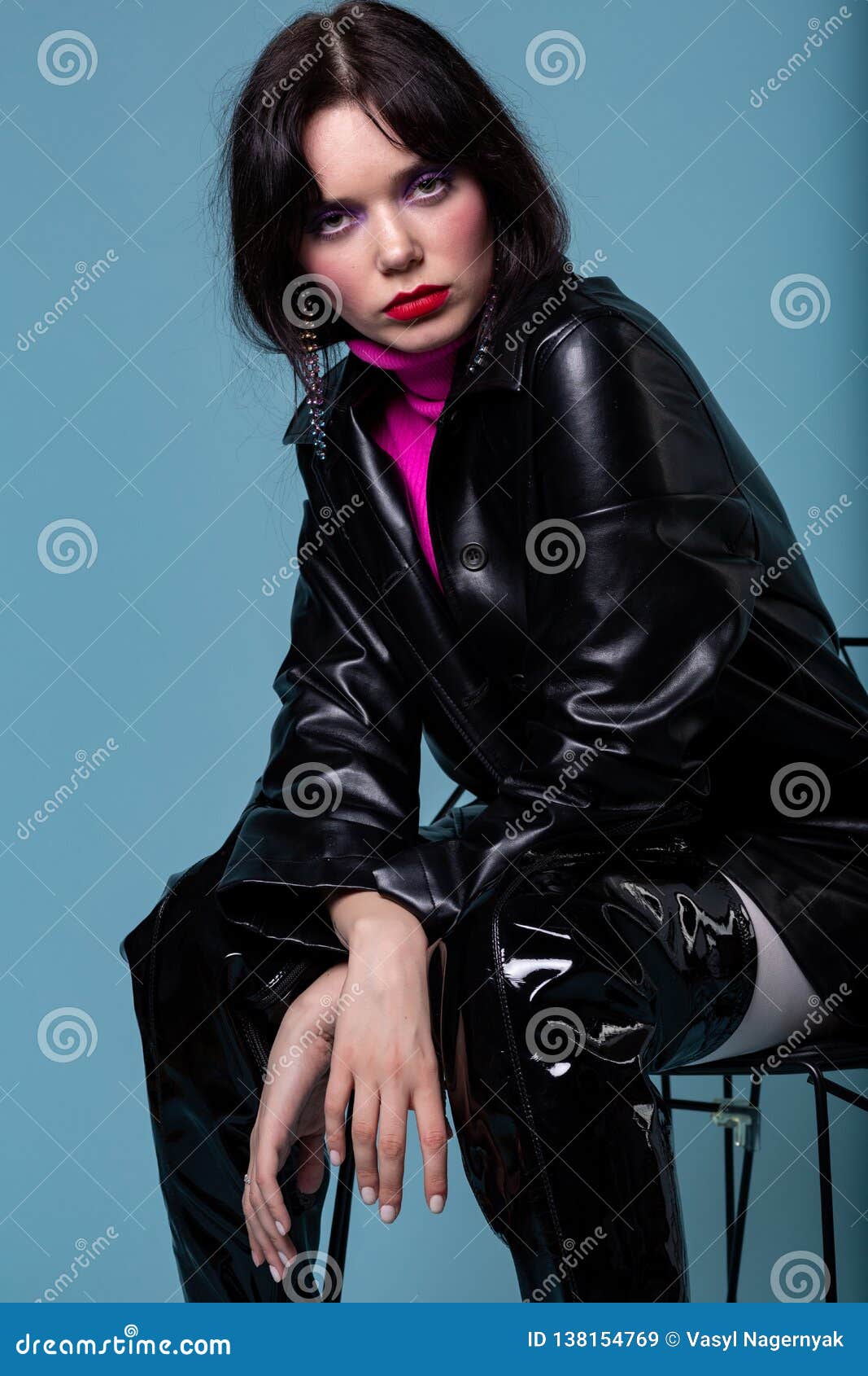 Portrait of a Fashion Female Sitting on Chair Posing in Attractive ...